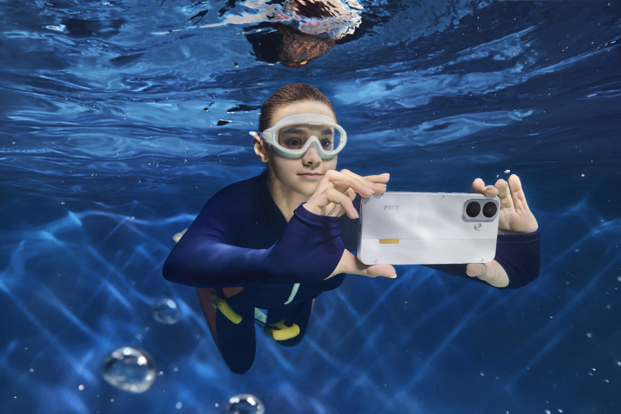 POCO X8 used near water to demonstrate its water-resistance features